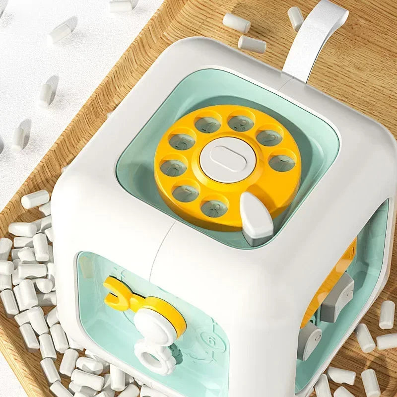 Cubo Montessori 6 em 1 – Brinquedo Sensorial Educativo com Atividades para Bebês Descubra um mundo de aprendizado e diversão em um só brinquedo!